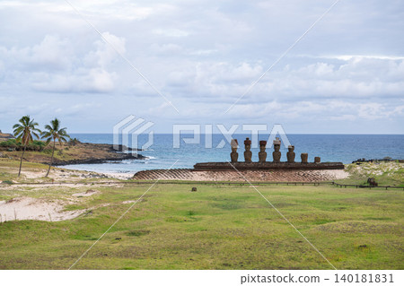 Peaceful majestic moai statue overlooking blue ocean coast of easter island chile Peaceful majestic moai statue overlooking blue ocean coast of easter island chile 140181831