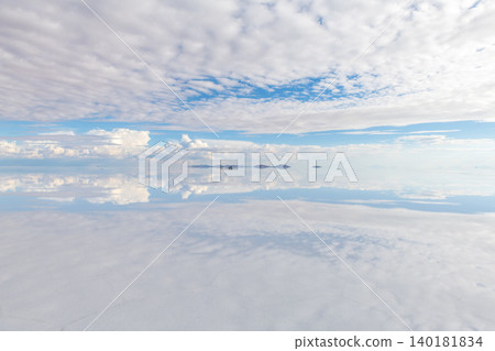 Serene vast landscape salt flat with sky reflection in uyuni bolivia Serene vast landscape salt flat with sky reflection in uyuni bolivia 140181834