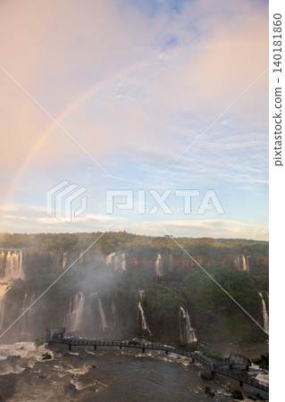 Peaceful scenic view of iguazu falls waterfall under bright rainbow in nature Peaceful scenic view of iguazu falls waterfall under bright rainbow in nature 140181860