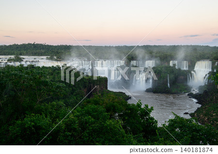 Majestic iguazu falls cascade through lush jungle bringing breathtaking awe Majestic iguazu falls cascade through lush jungle bringing breathtaking awe 140181874