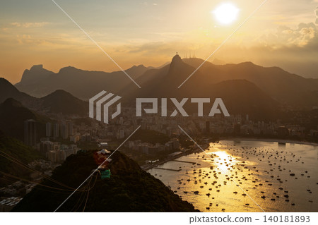 Serene sunset over Guanabara Bay and majestic mountain cityscape of Rio de Janeiro Brazil during golden hour 140181893