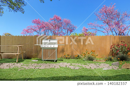 Backyard barbecue grill near wooden fence and blooming spring trees Backyard barbecue grill near wooden fence and blooming spring trees 140182337