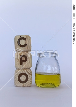 CPO crude palm oil and cooking oil in glass containers. Palm oil news concept CPO crude palm oil and cooking oil in glass containers. Palm oil news concept 140183085