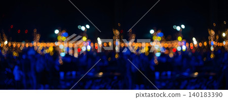 Blurred holiday background with bokeh. Defocused New Year and Christmas illumination. Blurred holiday background with bokeh. Defocused New Year and Christmas illumination. 140183390