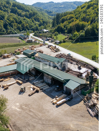 Aerial view of a sawmill factory in the mountains Aerial view of a sawmill factory in the mountains 140183391