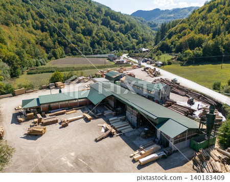 Aerial view of a sawmill factory in the mountains Aerial view of a sawmill factory in the mountains 140183409