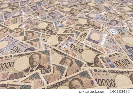 New Japanese banknotes. A low-angle shot showing many 10,000 yen, 5,000 yen, and 1,000 yen bills lined up. New Japanese banknotes. A low-angle shot showing many 10,000 yen, 5,000 yen, and 1,000 yen bills lined up. 140183483