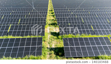 Aerial view of solar power station on a green field. Sustainable development. Aerial view of solar power station on a green field. Sustainable development. 140183488