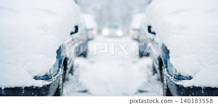 Parked car covered with snow during snow storm Parked car covered with snow during snow storm 140183558