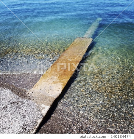 The crystal-clear, beautiful surface of Lake Geneva in Switzerland and the slope leading down to the lake. The crystal-clear, beautiful surface of Lake Geneva in Switzerland and the slope leading down to the lake. 140184474