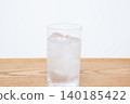 Ice water in a glass cup 140185422