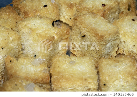 Close up of cubed fried bread croutons freshly made for soup Close up of cubed fried bread croutons freshly made for soup 140185466