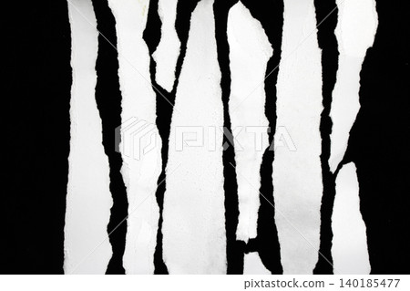Ripped and torn white paper tear oon black background Ripped and torn white paper tear oon black background 140185477