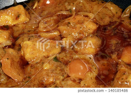 Close up of a thick Thai curry cooking in a wok Close up of a thick Thai curry cooking in a wok 140185486