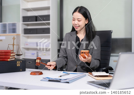 Lawyer singing in documents, filling court records, job responsibilities in office. Lawyer singing in documents, filling court records, job responsibilities in office. 140185652