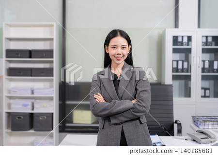 Smiling confident business woman leader portrait in modern office workplace. Smiling confident business woman leader portrait in modern office workplace. 140185681