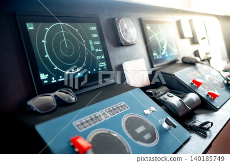 Digital dashboard with navigation monitor system, marine radar and VHF Radio in ship captain bridge Digital dashboard with navigation monitor system, marine radar and VHF Radio in ship captain bridge 140185749