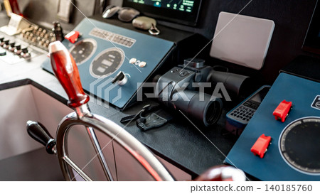 Digital dashboard with navigation monitor system, marine radar and binoculars in ship captain bridge Digital dashboard with navigation monitor system, marine radar and binoculars in ship captain bridge 140185760