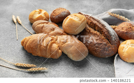 Freshly baked bread assortment with wheat ears 140186221