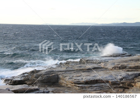 A landscape of rough seas and rocky coastlines A landscape of rough seas and rocky coastlines 140186567