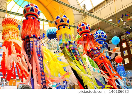 The vibrant Sendai Tanabata decorations sway gently in the cool breeze. The vibrant Sendai Tanabata decorations sway gently in the cool breeze. 140186683