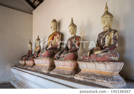 Row of Ancient Ayutthaya Period Buddha Statues in Thailand: Antique Red Lacquer and Gold Leaf Ruins on Historic Sculpture Row of Ancient Ayutthaya Period Buddha Statues in Thailand: Antique Red Lacquer and Gold Leaf Ruins on Historic Sculpture 140186887