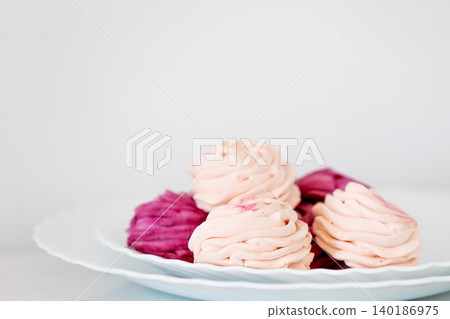 blackcurrant and apple zephyr on white plate blackcurrant and apple zephyr on white plate 140186975