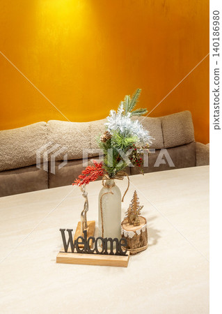 Cozy home interior featuring a Welcome sign Cozy home interior featuring a Welcome sign 140186980