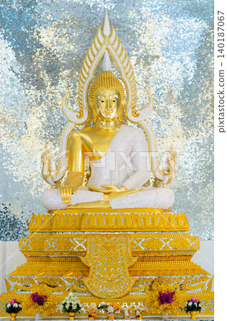 Golden Buddha Statue in Phra Phuttha Chinnarat Style Decorated with Sparkling Crystal Robe Against Silver Mirror Mosaic Background Golden Buddha Statue in Phra Phuttha Chinnarat Style Decorated with Sparkling Crystal Robe Against Silver Mirror Mosaic Background 140187067