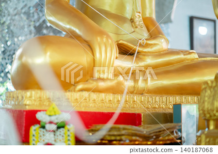 Majestic Golden Buddha Image with Elaborate Naga Arch and Shimmering Backdrop: Sacred Traditional Thailand Buddhism Artwork Majestic Golden Buddha Image with Elaborate Naga Arch and Shimmering Backdrop: Sacred Traditional Thailand Buddhism Artwork 140187068