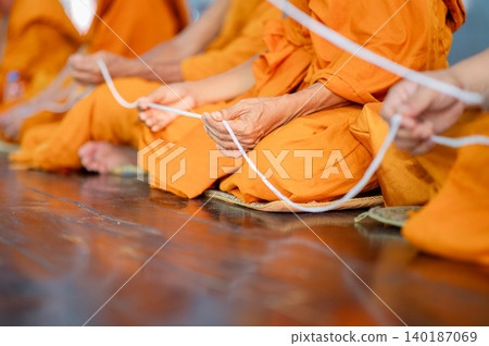 Buddhist Monks Holding White Thread, Thai Monk Ritual Close-up, Holy Thread Blessing Ceremony 140187069