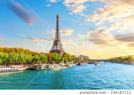 Eiffel Tower at stunning sunset over the Seine River and bridges in Paris, France Eiffel Tower at stunning sunset over the Seine River and bridges in Paris, France 140187112