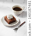 A piece of chocolate brownie with ice cream on a plate and a cup of espresso coffee 140187481