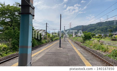 The platform of Nishimatsuida Station on the Shin'etsu Main Line and the peaceful mountain scenery. The platform of Nishimatsuida Station on the Shin'etsu Main Line and the peaceful mountain scenery. 140187850