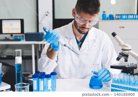 Lab technician experimenting in lab Lab technician experimenting in lab 140188900