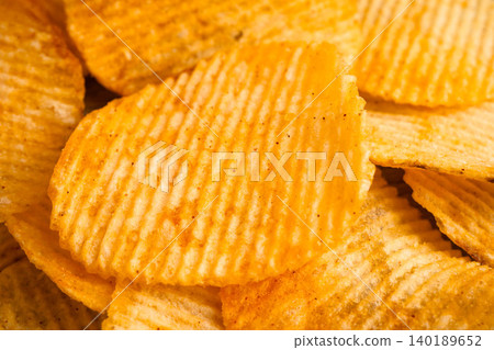 Potato chips , delicious BBQ seasoning spicy for crips, thin slice deep fried snack fast food. Potato chips , delicious BBQ seasoning spicy for crips, thin slice deep fried snack fast food. 140189652