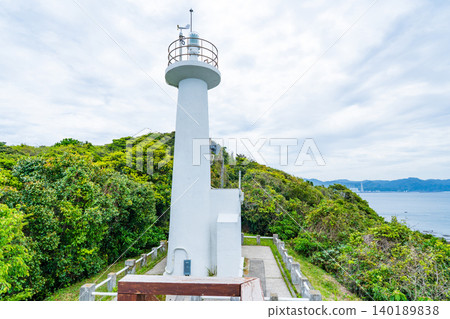 Shikisaki Cape Lighthouse, located at the tip of the Tomioka Peninsula in Reihoku Town, Kumamoto Prefecture. Shikisaki Cape Lighthouse, located at the tip of the Tomioka Peninsula in Reihoku Town, Kumamoto Prefecture. 140189838