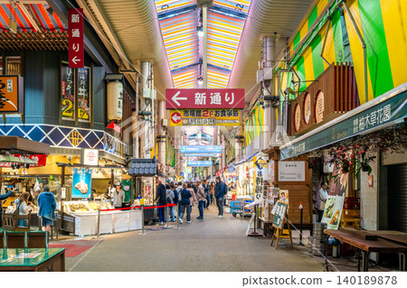 A lively scene from the arcade street of Omicho Market, Kanazawa's kitchen. A lively scene from the arcade street of Omicho Market, Kanazawa's kitchen. 140189878