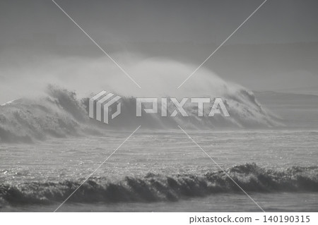 The Shonan coast after the typhoon has passed. Huge swells are crashing against the shore. The Shonan coast after the typhoon has passed. Huge swells are crashing against the shore. 140190315