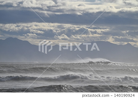 The Shonan coast after the typhoon has passed. Huge swells are crashing against the shore. 140190924