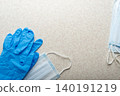 Medical face masks and single use gloves laying on table flat lay view 140191219
