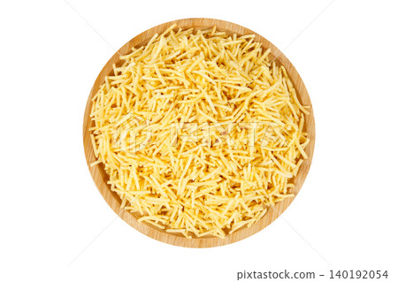 Crispy, shoestring-style potato sticks served on a round wooden plate. Traditional Brazilian shoestring fries isolated on a white background Crispy, shoestring-style potato sticks served on a round wooden plate. Traditional Brazilian shoestring fries isolated on a white background 140192054