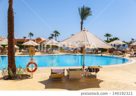 Egypt, Sharm el-Sheikh - September 24, 2025. Well-maintained area, swimming pool and beach of the Savoy Hotel. Editorial 140192321