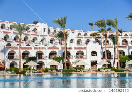 Egypt, Sharm el-Sheikh - September 25, 2025. Well-maintained area, swimming pool and beach of the Savoy Hotel. Editorial Egypt, Sharm el-Sheikh - September 25, 2025. Well-maintained area, swimming pool and beach of the Savoy Hotel. Editorial 140192323