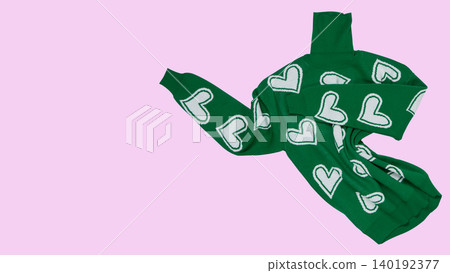 Green knitted turtleneck sweater with white hearts pattern floating in air on pink background, copy space. Green knitted turtleneck sweater with white hearts pattern floating in air on pink background, copy space. 140192377