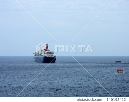 A cruise ship anchored off the coast of Yaene Fishing Port on Hachijo Island. A cruise ship anchored off the coast of Yaene Fishing Port on Hachijo Island. 140192412
