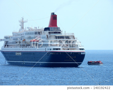 A cruise ship anchored off the coast of Yaene Fishing Port on Hachijo Island. A cruise ship anchored off the coast of Yaene Fishing Port on Hachijo Island. 140192422