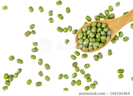 Top view of green mung beans scattered with a wooden spoon. Healthy plant-based protein source and dry legumes for cooking. Isolated. Top view of green mung beans scattered with a wooden spoon. Healthy plant-based protein source and dry legumes for cooking. Isolated. 140192464