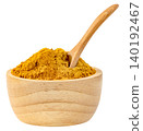 Turmeric powder in a small wooden bowl with a wooden spoon isolated. Yellow curry spice for cooking and healthy supplements. High quality studio shot for food concepts. 140192467