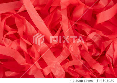Red paper strips scattered on the surface for decoration or crafts Red paper strips scattered on the surface for decoration or crafts 140193089